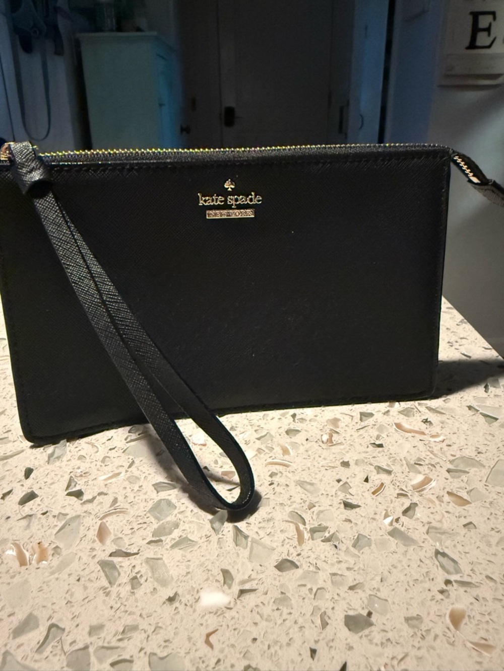 kate spade black saffiano wristlet with gold logo